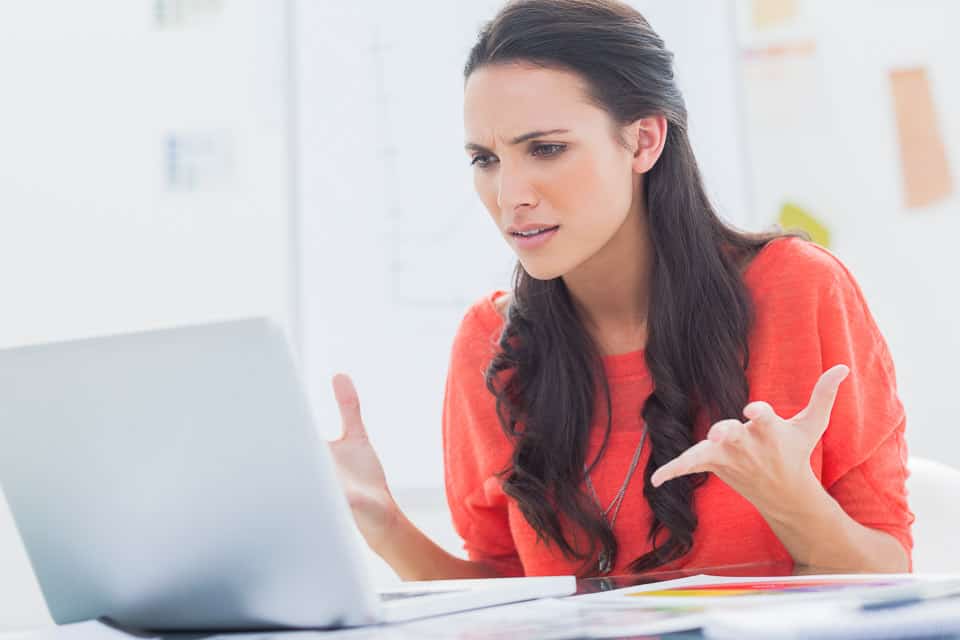 Woman frustrated with laptop